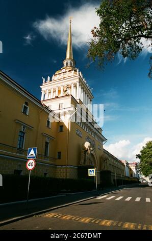 The Admiralty building in St.Petersburg, Russia with nymphs holding globes and empty street in sunny summer day copy space Stock Photo