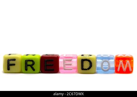 word freedom in rainbow colored cubes isolated on white background, heart symbol Stock Photo