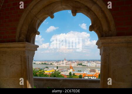 Budapest, Hungary - june 27th 2020 - Hungarian Parliament Building seen from the Fisherman's Bastion during Corona time on a sunny day with some touri Stock Photo