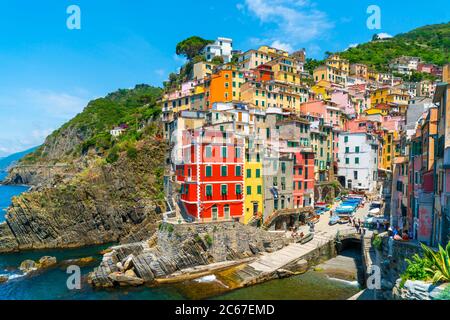Cinque Terre, Italy - july 1st 2020 - Overview of the village Riomaggiore with a very quiet square due to Corona, one of the towns known as Cinque Ter Stock Photo