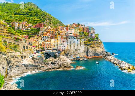 Cinque Terre, Italy - july 1st 2020 - Overview of the very quiet village Manarola due to Corona, one of the towns known as Cinque Terre at the Medeter Stock Photo