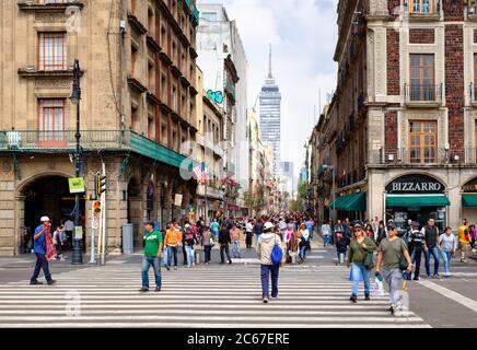 MEXICO CITY,MEXICO - JULY 12,2018 :  People, shops and restaurants at the always busy Madero boulevard in downtown Mexico City Stock Photo