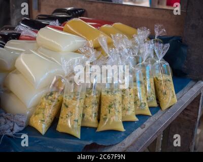 Spices and juices in plastic bags at a local market in a small village Caballococha on the banks of Amazon River,  Amazonia, Peru. South America. Stock Photo
