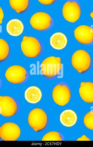 Pattern with lemon fruits. Tropical abstract geometric balance citrus on classic blue color background. Trendy summer pattern. Minimal fashion concept. Flat lay, close up. Stock Photo