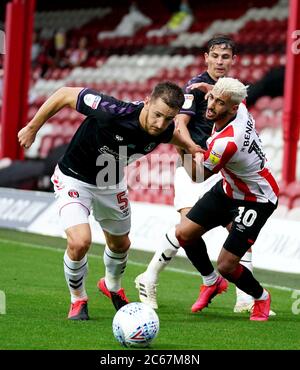 Charlton Athletic's Tom Lockyer (left) and Brentford's Said Benrahama (right) battle for the ball during the Sky Bet Championship match at Griffin Park, London. Stock Photo