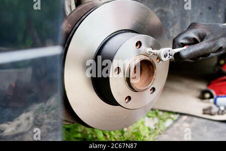 Repairing of car disc brake system. Stock Photo