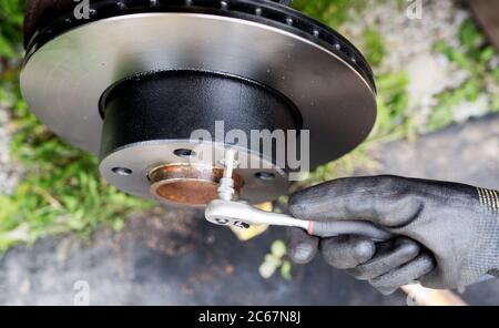 Repairing of car disc brake system. Stock Photo
