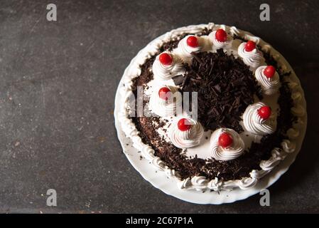 Black forest cake on a background with use of selective focus Stock Photo
