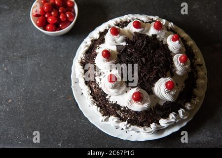Cherries and Black forest cake with use of selective focus