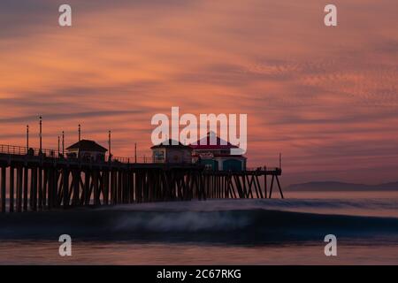 Sunset at Huntington Beach Pier with Ruby's Diner, California, USA Stock Photo