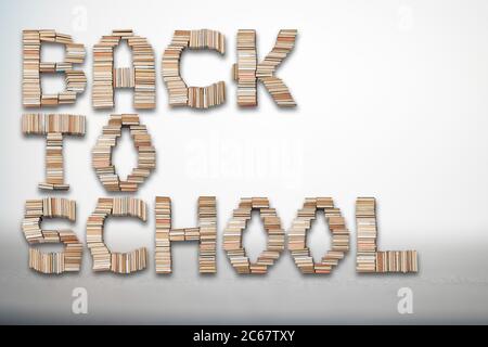 Back to school text letters made of old vintage books on white background Stock Photo