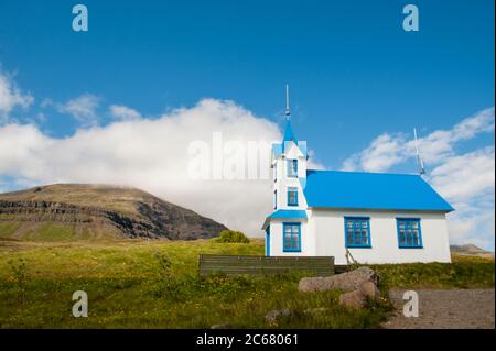 small blue church in iceland