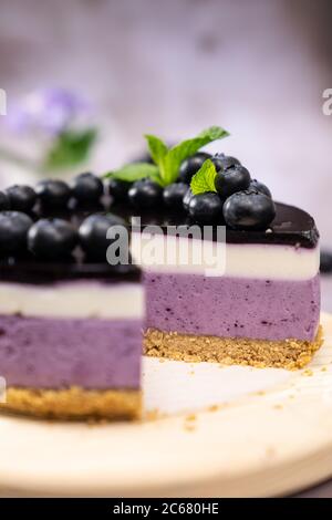blue vegan cheesecake with fresh blueberries and butterfly ...