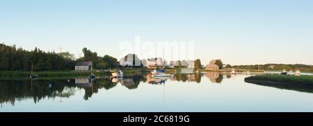 Boats moored in Snug Harbor at dawn, West Falmouth, Massachusetts, USA Stock Photo