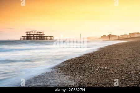 Golden Sunset on Brighton Beach - Brighton, England Stock Photo