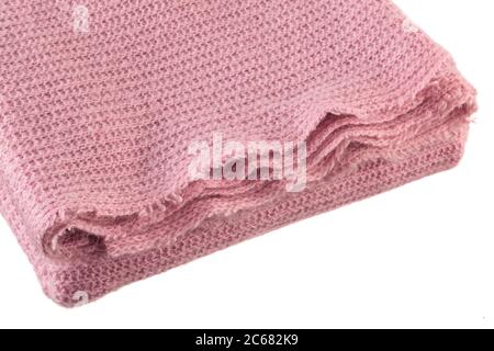 Closeup shot of knitted pink blanket isolated on white background. Stock Photo