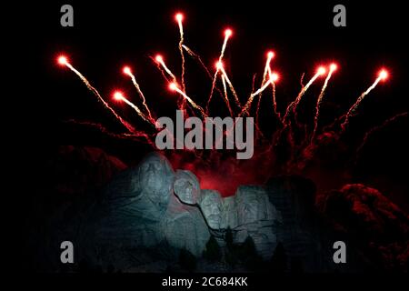 Fireworks explode over the colossal sculpture faces at Mount Rushmore National Memorial during the Salute to America Independence Day celebration July 3, 2020 in Keystone, South Dakota. Stock Photo