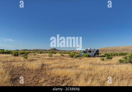 RV isolated while camping Stock Photo
