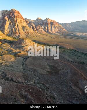 An aerial view shows a beautiful mountain landscape that rises from the desert surrounding Las Vegas, Nevada. This desert area is extremely warm. Stock Photo