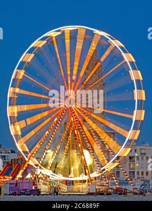 Long exposure of illuminated Ferris Wheel, Le Havre, France Stock Photo