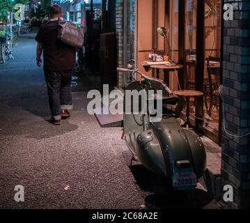 Old vespa motorcycle in the street sidewalk of Kamimeguro, Tokyo, Japan. Stock Photo