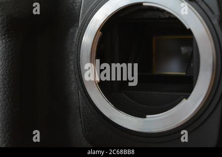 Bayonet mount of APS-C DSLR camera. Low key. Selective focus. Stock Photo
