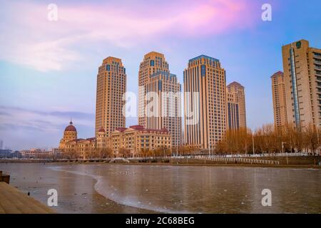 Tianjin, China - Jan 16 2020: Cityscape of Tianjin city with buiding and architecture on the side of Haihe river bank Stock Photo