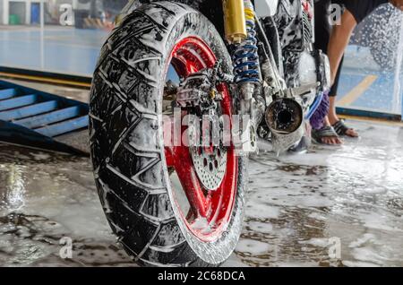 Bubble foam cleaning motorcycle wash Stock Photo