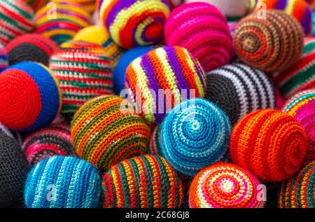 Colorful fabric textile wool balls on the Andes craft market of Otavalo, north of Quito, Ecuador. Stock Photo