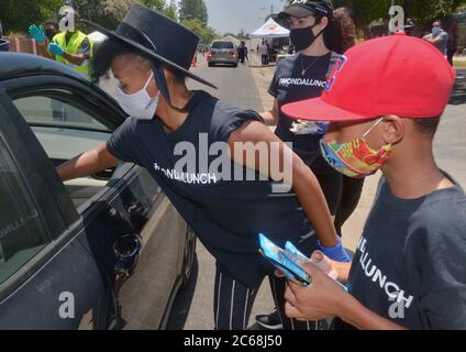 Los Angeles, United States. 08th July, 2020. Singer and actress Janelle Monae helps distribute fresh food to families that have been impacted by the coronavirus pandemic on behalf of WondaLunch at Ted Watkins Park in the Watts area of Los Angeles on Tuesday, July 7, 2020. Monae launched her WondaLunch food give-away in April in Atlanta and brought it to Southern California in May. She helped hand out 2,000 prepared meals Tuesday in partnership with US Rep. Maxine Waters (D-CA). Photo by Jim Ruymen/UPI Credit: UPI/Alamy Live News Stock Photo