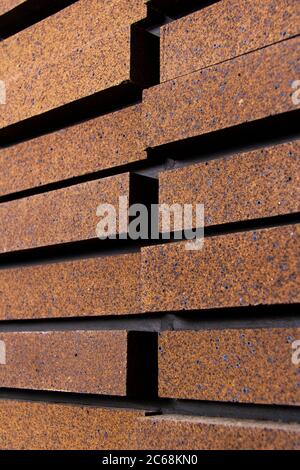 View from a side angle of bricks side by side - on a wall. The front of the brick wall photo Stock Photo