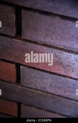View from a side angle of bricks side by side - on a wall. The front of the brick wall photo Stock Photo