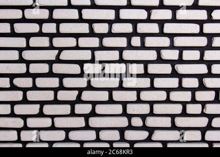 Irregular brick arrangement. On the wall. In black and white. Stock Photo