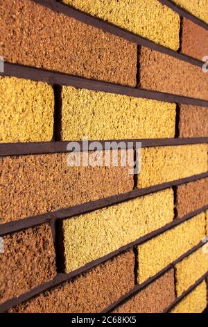 View from a side angle of bricks side by side - on a wall. The front of the brick wall photo Stock Photo