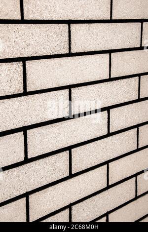 View from a side angle of bricks side by side - on a wall. The front of the brick wall photo Stock Photo