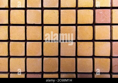 Square layout of bricks side by side - on a wall. The front of the brick wall photo Stock Photo