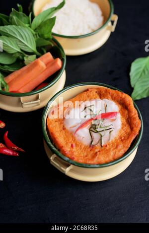 Good looking Thai steamed fish curry served in tiffin Stock Photo