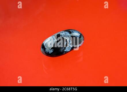 Black agate with transparent white quartz inclusions Stock Photo