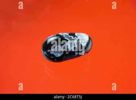 Black agate with transparent white quartz inclusions Stock Photo
