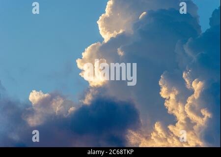 A Fluffy White Cloudscape of Cumulus Clouds and A Sky Blue Background Stock Photo