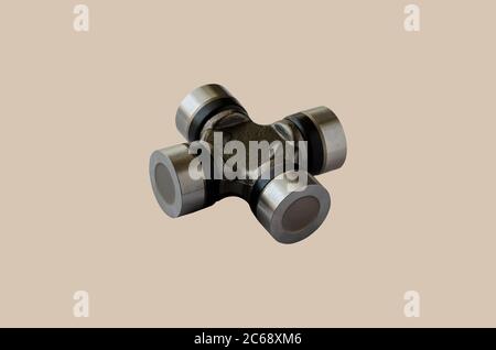 Cross joint for propeller shaft. New auto part for transmission. Trade Auto parts, car service. Automotive industry. Selective focus. Stock Photo