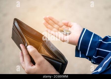 An empty purse in his hands Stock Photo - Alamy