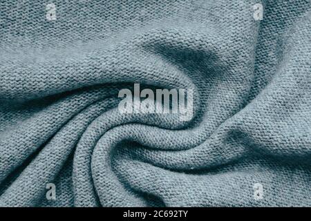 Knitted texture background in trendy gray for wallpapers and backgrounds. Homemade knitting. Stock Photo