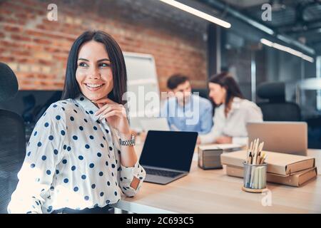 Cheerful office worker look through the window Stock Photo