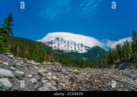 Mount Rainier with a cloud cap on it, on a sunny day. Stock Photo