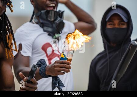 portrait of young armed afroamerican men on demonstration, independent citizens go to protest and defend rights of black people Stock Photo
