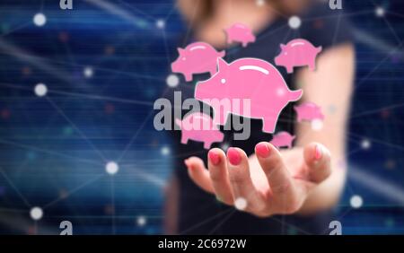 Money saving concept above the hand of a woman in background Stock Photo