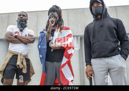 portrait of young armed afroamerican men on demonstration, independent citizens go to protest and defend rights of black people Stock Photo
