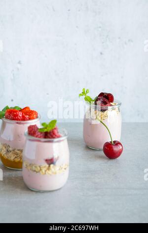 Yogurt with granola and berries.  Stock Photo