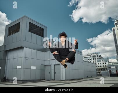 Handsome young man meditating in the air Stock Photo